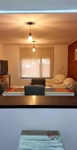 a room with a bedroom with a bed and a window at Duplex Boulevard D in Viedma