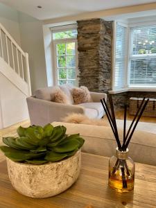 a living room with a couch and a table at Pottery Gate, Bowness-on-Windermere in Bowness-on-Windermere