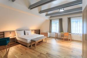 Postel nebo postele na pokoji v ubytování Hotel a restaurace U Vychopňů