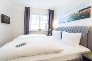 Cama ou camas em um quarto em Strandvilla Seeadler hinter Düne und Meer