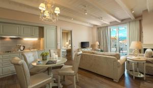 a living room with a couch and a table at Kyniska Palace Conference & Spa in Mystras