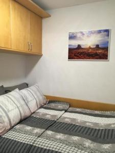 Postel nebo postele na pokoji v ubytování Sunrise in Terme Catez