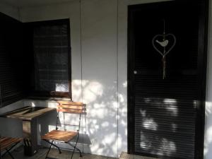 a room with a chair and a heart key on the door at Sunrise in Terme Catez in Čatež ob Savi