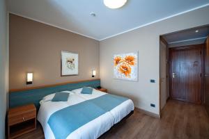 Voodi või voodid majutusasutuse Albergo San Carlo toas