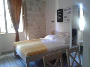 Postel nebo postele na pokoji v ubytování Apartments Mila