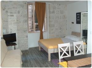 TV a/nebo společenská místnost v ubytování Apartments Mila