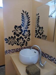 a bathroom with a sink and a mirror at Zanzicrown in Nungwi