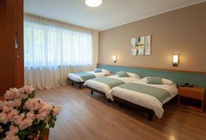 Voodi või voodid majutusasutuse Albergo San Carlo toas
