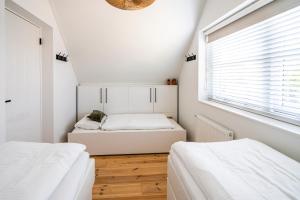 เตียงในห้องที่ VIKINGHUIS Bed by the Sea +23 ภาพ
