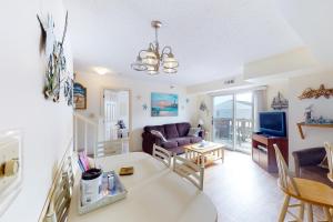 a living room with a couch and a table at Surfcrest 201 in Ocean City
