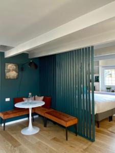 a bedroom with a table and a bed and a table and chairs at Paradise Penthouse Suite Amazing View in Rome +37 photos