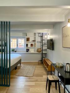 a bedroom with a bed and a living room at Paradise Penthouse Suite Amazing View in Rome