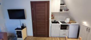 Eldhús eða eldhúskrókur á Apartman Monika Wind Resort