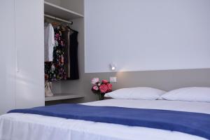 A bed or beds in a room at Residenza Ai Ferrari