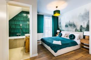 Ein Bett oder Betten in einem Zimmer der Unterkunft Przystanek Babia Apartamenty