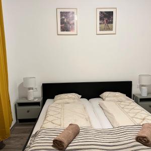 A bed or beds in a room at Aracsa Farm és Vendégház Kis Balaton és termál fürdők
