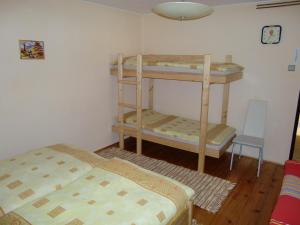A bed or beds in a room at Chalupa Kucbel