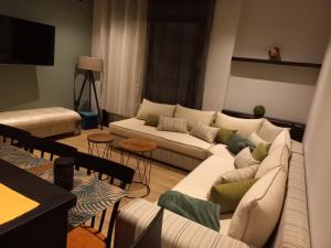 a living room with a couch and a table at Captivating 2-Bed Apartment in Tunis in Tunis