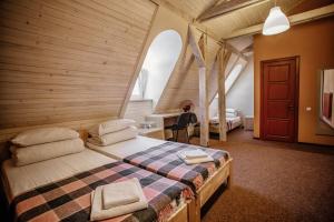 Postel nebo postele na pokoji v ubytování Guest House "Arkhistratyg"