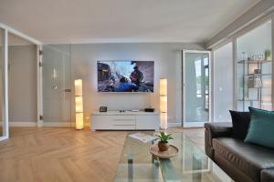 a living room with a couch and a table at Seaside Seaside Appartement 18 in Timmendorfer Strand