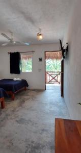 Postel nebo postele na pokoji v ubytování Hotel Xa´an Bacalar