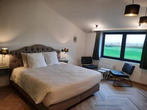 Postel nebo postele na pokoji v ubytování Op 't Roth 12 ruime sfeervolle vakantiewoning in 't groen