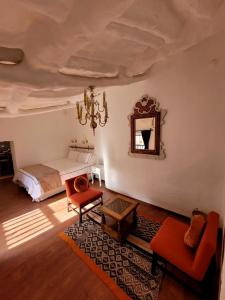 a bedroom with a bed and a mirror on the wall at Anqas Apartment Cusco in Cusco