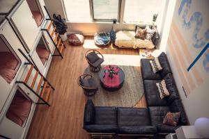 an overhead view of a living room with a couch and a table at STAY OPEN Venice Beach in Los Angeles
