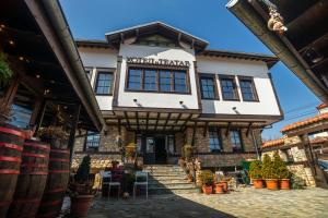 a building with a sign that reads wolfgang brewery at Hotel Theatre in Bitola