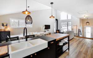 a kitchen with a sink and a counter top at 01 Chemin des Cascades in Stoneham