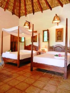 En eller flere senge i et værelse på La Buena Vista