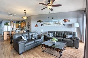 a living room with two leather couches and a table at Rocky Point Sonoran Resorts in Puerto Peñasco