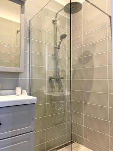 a shower with a glass door in a bathroom at Domaine Séquoia in Stutzheim +21 photos