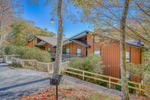 a house with a fence in front of it at Bee Branch 05 in Sugar Mountain