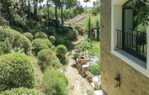 a view of a garden with a train in a yard at 5 Bedroom Nice Home In Azillanet in Azillanet +48 photos