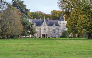 a large castle in a field of grass at Holiday Home Chenille-Change I-919 in Chenillé-Changé