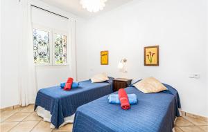 Posteľ alebo postele v izbe v ubytovaní 3 Bedroom Awesome Home In Porto Petro