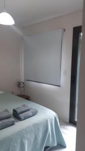 Cama ou camas em um quarto em Cipreses 1 MONOAMB EN EL CENTRO