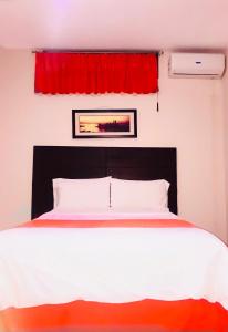 Katil atau katil-katil dalam bilik di Hotel Madrigal
