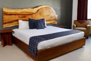 Tempat tidur dalam kamar di Hotel Samanu