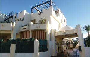 a white building with a gate in front of it at 3 Bedroom Awesome Home In Nerja in Nerja