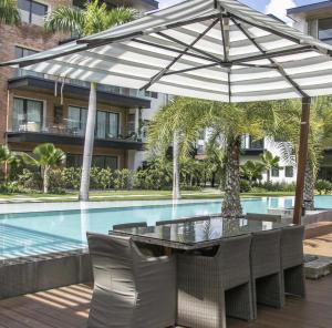 Bazén v ubytování Luxury new apartment in Cap Cana Punta Cana nebo v jeho okolí