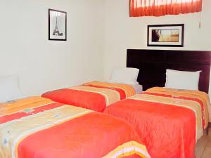 Katil atau katil-katil dalam bilik di Hotel Madrigal