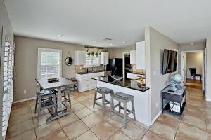 a kitchen with a table and chairs and a counter top at Festive Beach Retreat in Rockport