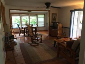 a living room with a table and chairs at Rushing Stone Cottage in Jefferson