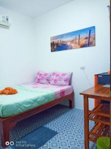 Postel nebo postele na pokoji v ubytování Samed Runa Village