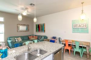 a kitchen and living room with a couch at Ocean Pulse in Corpus Christi