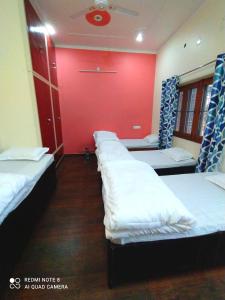 A bed or beds in a room at Stayble Homestay