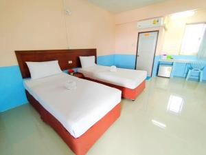 מיטה או מיטות בחדר ב-Station Hotel