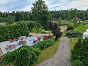 an aerial view of a garden with a pool and tables at Bille in Bille